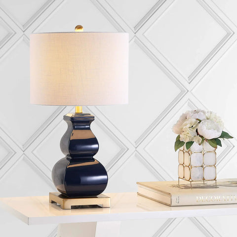 Navy Blue And Gold Ceramic Table Lamp With White Linen Shade on modern table, footed vase design, LED bulb, for living room decor