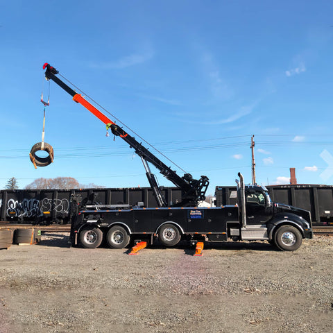 Tow truck lifting load with Green 12 Ft Endless Round Sling With 5300 Lb Vertical Capacity And 10600 Lb Basket Capacity Quality USA Made