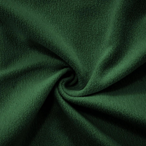 Close-up of Modern Green Tufted Modular Sofa Chair Right Facing Armless Sectional Module With Fluffy Accent Pillows fabric texture.