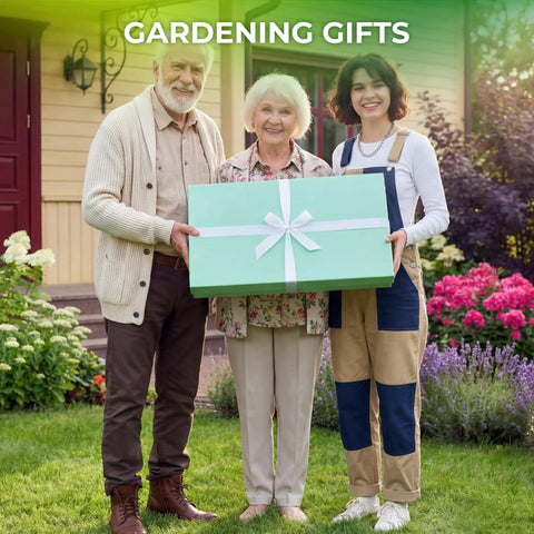 Three people standing in a garden holding a large green gift box with a ribbon labeled 'Gardening Gifts' in front of a house.