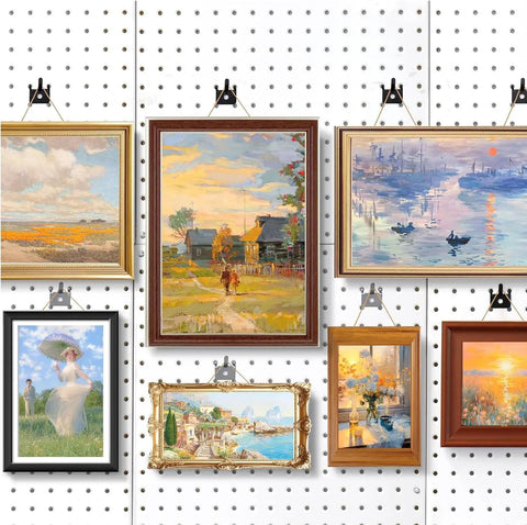 Gallery wall with art using 20 Pack Black Pegboard Picture Hangers For One Eighth And One Quarter Inch Boards With U Shape Prong Design.
