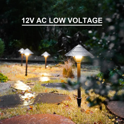 4 Pack Low Voltage Path Lights Kit With 2W LEDs 100 Lumen Warm White 2700K Bronze Outdoor Walkway Lighting in garden setting