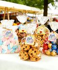 Clear Cellophane Treat Bags 200 Pack 6X10 Inch With Gold Twist Ties For Cookies Candy Birthday Party Favors Graduation And Homemade Bakery Packaging Must Have Bulk Value Pack Food Grade Small Candy Bags displaying cookies and candies.