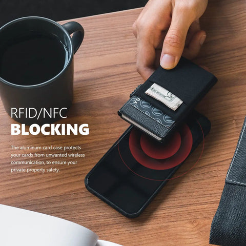 Slim Minimalist RFID Blocking Wallet with ID Window and Pop Up Card Holder next to smartphone on wooden table.