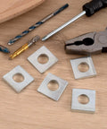 Beveled Square Washers Set Of Six For Leveling One Half Inch Inner Diameter And One And One Eighth Inch Outer Diameter Thick From Two To Six Point Six Millimeter Plain Carbon Steel Galvanized Shims In Silver Finish DC CLISENCE, shown with tools.