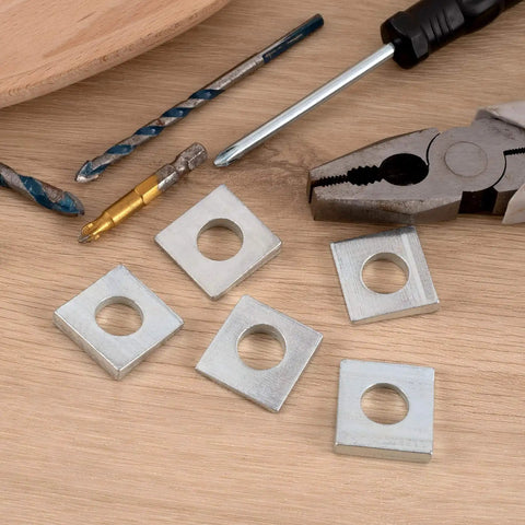 Beveled Square Washers Set Of Six For Leveling One Half Inch Inner Diameter And One And One Eighth Inch Outer Diameter Thick From Two To Six Point Six Millimeter Plain Carbon Steel Galvanized Shims In Silver Finish DC CLISENCE, shown with tools.