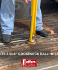 Person using Gooseneck Hitch Alignment Helper With Bright Yellow Rubberized Ball Thirty Inch Long Three Quarter Inch Wide Designed For Trucks Trailers Campers RVs Farm Equipment Towing Utility Automotive Use Makes Aligning And Hooking Up Quick And Hassle Free on truck bed