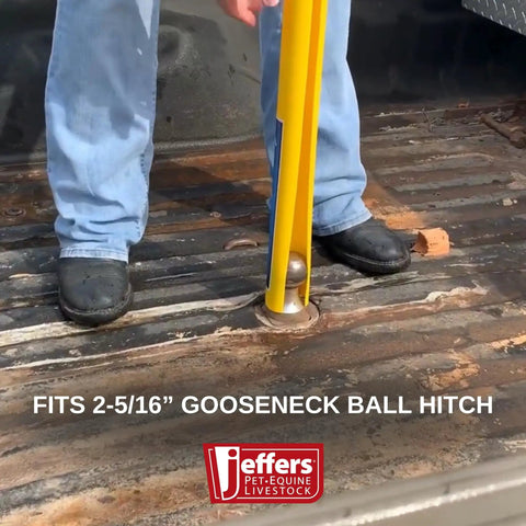 Person using Gooseneck Hitch Alignment Helper With Bright Yellow Rubberized Ball Thirty Inch Long Three Quarter Inch Wide Designed For Trucks Trailers Campers RVs Farm Equipment Towing Utility Automotive Use Makes Aligning And Hooking Up Quick And Hassle Free on truck bed
