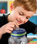 Child inserting coin into Digital Coin Counter Money Jar With LCD Display And Automatic Piggy Bank For US Coins Battery Powered