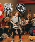 Route 66 Retro Party Balloons Kit With Vintage Car Tire Decor And Vinyl Record Foil Balloons in a rock and roll party scene