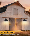 Gooseneck Solar Barn Light 12 Inch Black Outdoor Wall Mount Set installed on barn, illuminating entrance at dusk.