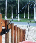 Solid As A Rock Heavy Duty Deck Hooks For Hanging Flower Baskets Bird Feeders And String Lights mounted on wooden railing.