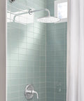 Spectra Plus 11 Inch Rain Shower Head With 2.5 GPM Flow Polished Nickel Finish in a tiled shower setting