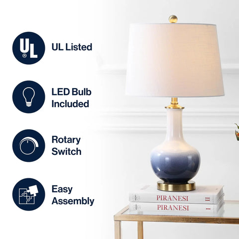 Gradient 25 Inch Ceramic And Brass LED Table Lamp For Bedroom Living Room Office And College Desk Nightstand Accent Light With Included LED Bulb For A Chill Vibe Contemporary Traditional Style In White Navy Finish on table with white shade