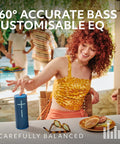 Woman enjoying Boom 4 Portable Waterproof Bluetooth Speaker With 360 Degree Sound Crystal Clear Audio And Bass at a poolside gathering