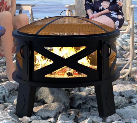 Heavy Duty Portable 26 Inch Steel Fire Pit With Grill Grate And Spark Screen on rocky beach