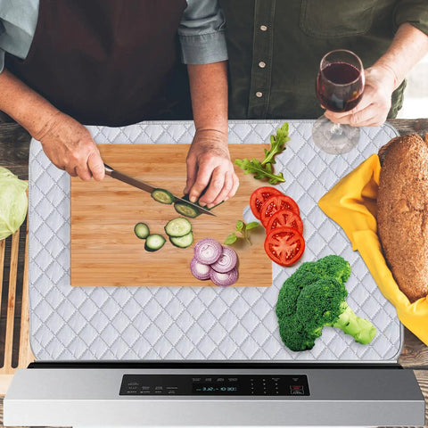 Quilted Stove Top Cover Protector For Glass Ceramic Cooktops as cutting board with vegetables and bread on kitchen counter