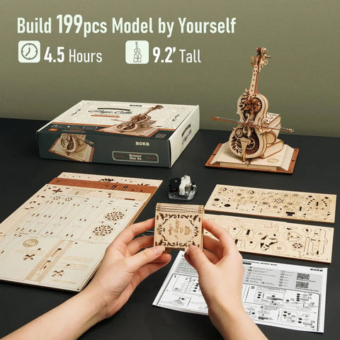 One Fifth Scale 3D Cello Model Kit With Base 199 Piece Wooden Music Box Building Kit pieces and completed model on table
