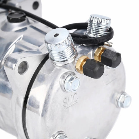 Heavy Duty Universal AC Compressor With Clutch Included For Quick Car Cooling Fixes Built Tough With Cast Aluminum Housing And Pregfilled PAG Oil Super Smooth Plug And Play Swap close-up showing fittings and cast aluminum detail.