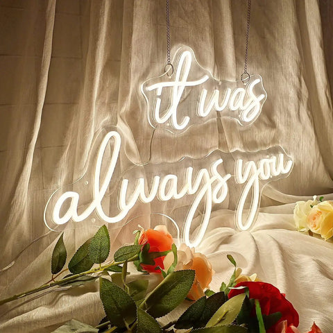 It Was Always You Neon Sign 36 Inch White Neon Night Light Dimmable Wall Decor above fabric backdrop with flowers in view.
