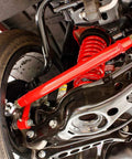 Rear Adjustable Toe Rod Kit With Spherical Rod Ends And Red Powder Coat For Chevy Camaro 2016 undercarriage view.