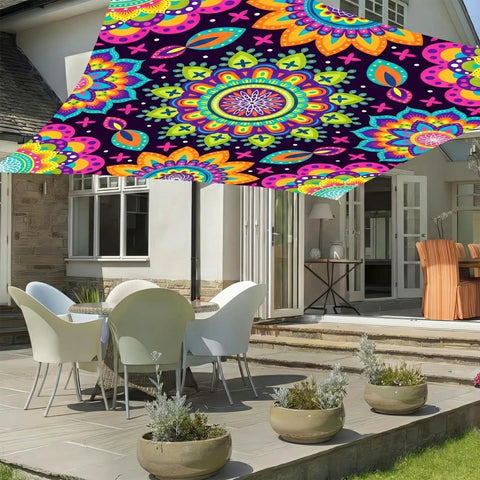 Neon Mandala UV Reactive Sun Shade Sail 6 By 8 Feet blacklight glow canopy installed over patio with chairs and table for outdoor décor.
