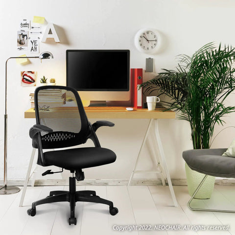 Ergonomic office and gaming chair with lumbar support in home office setting with desk and computer, breathable mesh back, black color