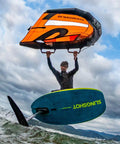 Man using SlingWing V4 Foil Wing 7M Yellow for wing foil boards on ocean, showcasing high-tension canopy and smooth power delivery.
