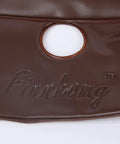 Close-up of brown PVC material with circular hole in Two Pack 15 Gallon Tree Watering Bags, Heavy Duty PVC Plant Watering System.