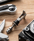 Close-up of 8 Pack M8x110mm X Shaped Toggle Bolts Heavy Duty Wall Anchors Stainless Steel 304 Scissors Type for installation.