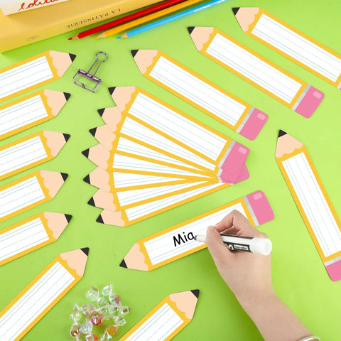 36 Pack Magnetic Dry Erase Name Tags 7.8 x 1.57 Inches Reusable Erasable Pencil Labels being written on with a marker
