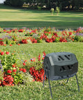 Dual Chamber Tumbler Composter With 42 Gallon Capacity For Yard, Garden And Kitchen Waste, Outdoor Rotating Bin in garden.