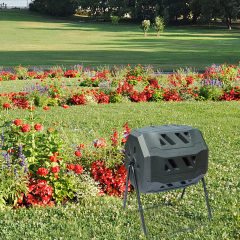 Dual Chamber Tumbler Composter With 42 Gallon Capacity For Yard, Garden And Kitchen Waste, Outdoor Rotating Bin in garden.