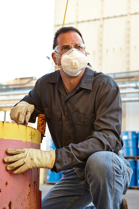 Disposable N100 Particulate Respirator With Exhalation Valve NIOSH Approved For Non Oil Based Particles worn by worker
