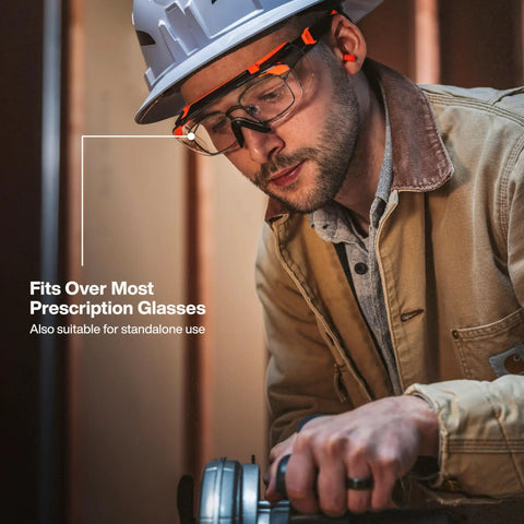 Professional Over The Glasses Safety Glasses With Clear Lens And Anti Fog Scratch Resistant Coating Ansi Z87 Plus Csa Z94 Certified worn by a worker fitting over prescription glasses.