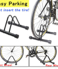 Space Saving Bike Rack Stand For Mountain And Road Bikes, Adjustable Width, Fits Most 26 Inch Wheels, Indoor Outdoor Garage Or Home Storage, Sturdy Lightweight Floor Stand With Rubber Feet holding a bike