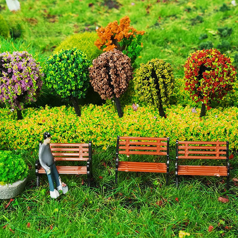 Eight Piece 1 To 24 Scale Mini Park Street Bench Set For Dollhouse And Fairy Garden Brown Tiny Benches against lush foliage