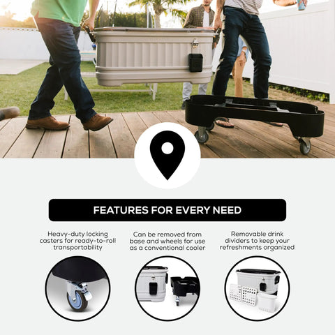 Two people transporting a 125 Qt Gray Party Bar Wheeled Cooler with Ultratherm Insulation, removable lid, and locking casters.