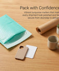Teal 5x6 Inch Poly Bubble Mailers With Self Seal Adhesive Waterproof Padded Shipping Bags For Small Biz Packing on wooden desk
