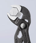 Cobra Water Pump Pliers 6 Inch With Self Locking Teeth And Pinch Guard For Safe Grip holding a hex nut, close-up view.
