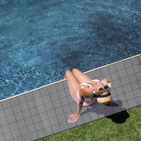 3 By 10 Ft Drainage Pool Floor Mats Non Slip PVC Splash Matting With Mesh Hollow Design next to a swimming pool.