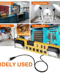 Heavy Duty Six Outlet Power Strip With Bright Led Worklight And Dual Usb Charging Ports For Fast Device Connections shown in garage, workshop, and photo studio.
