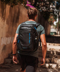 Person carrying Backpack Cooler Insulated Leakproof Fits 33 Cans With Dual Insulated Compartments Portable Lightweight Beach Travel