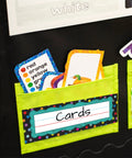 Polka Dot Chalkboard Nameplates Set 36 Colorful Name Labels for Kids visible on a lime green pouch holding colorful cards.