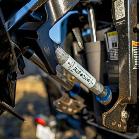 Close-up of Motor Stik Pair Heavy Duty 8.75 Inch Transom Saver For Outboard Trailering stabilizing trim rams on a boat engine