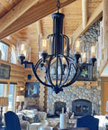 Chandelier with clear lipless glass lamp shade cylindrical light cover in rustic living room setting.