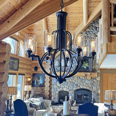 Chandelier with clear lipless glass lamp shade cylindrical light cover in rustic living room setting.
