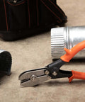 Nine and Three Quarters Inch Five Blade Hand Crimper for Gutters, Downspouts, and Metal Pipe Connections shown on concrete floor