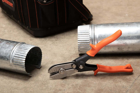 Nine and Three Quarters Inch Five Blade Hand Crimper for Gutters, Downspouts, and Metal Pipe Connections shown on concrete floor