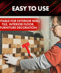 Man using red Dead Blow Hammer Set With 16 Ounce 27 Ounce And 45 Ounce Heads Red And Black Shockproof No Rebound Mallet for tiling wall.
